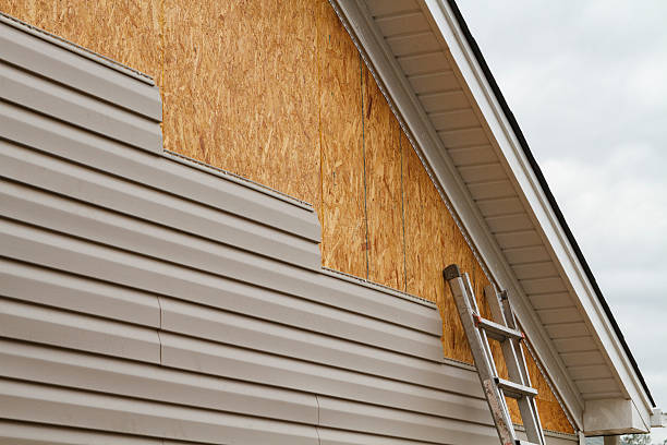 Professional Emergency Siding Repair technician working in Fairfax, OH
